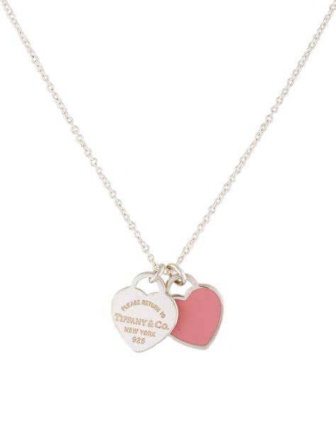 Tiffany and co pink double heart necklace - This pendant reinvents the classic with a pair of iconic heart tags in a mix of metals. A duo of sterling silver and rose gold charms hang from a link chain. Style with other delicate necklaces for a perfectly layered look. Sterling silver and …